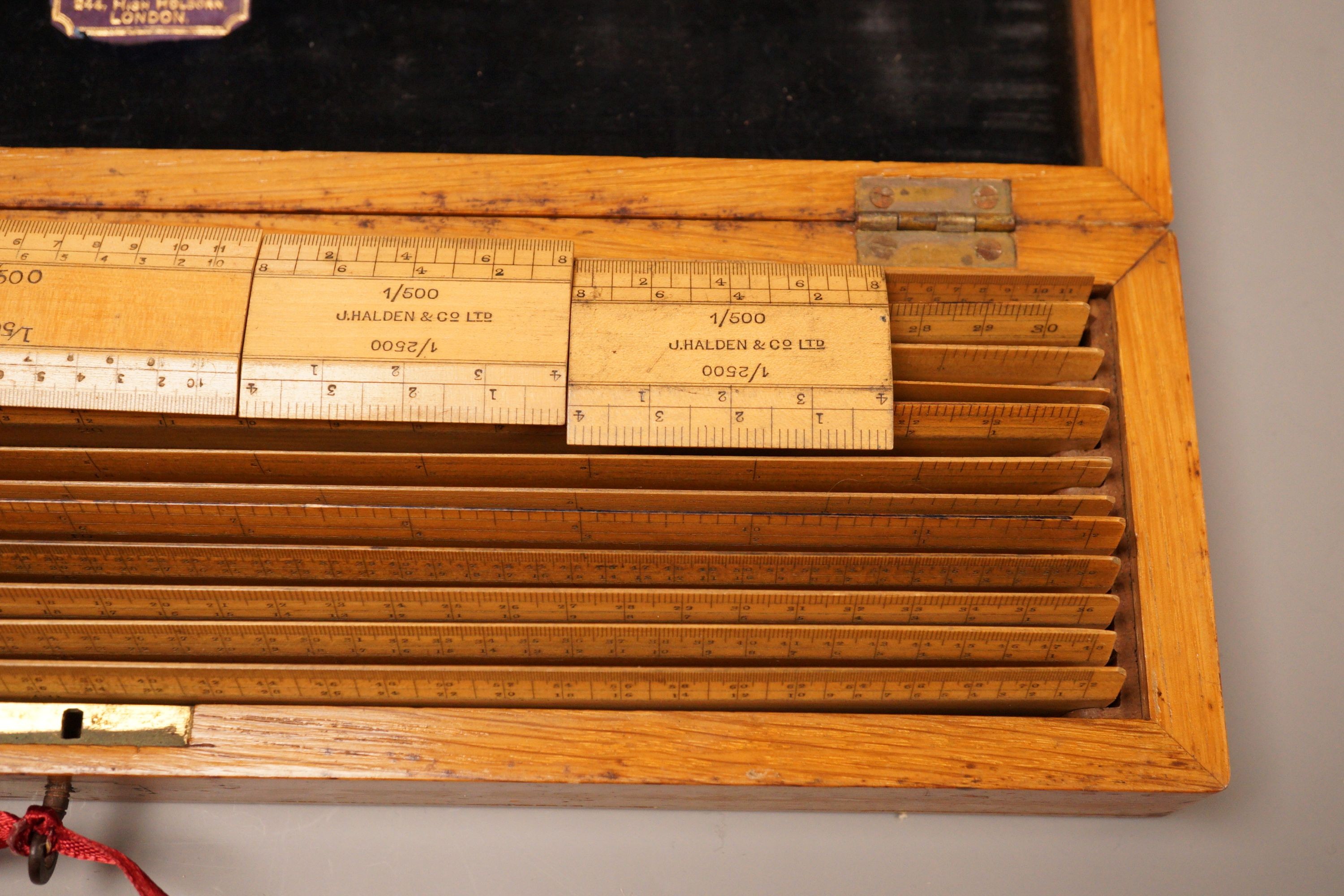 An oak cased set of draughtsman's rules